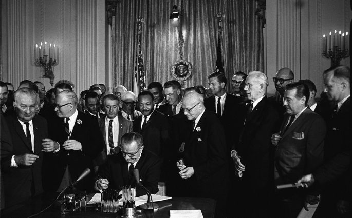 Lyndon Johnson signing Civil Rights Act