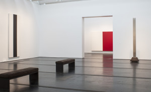 Barnett Newman: The Late Works, The Menil Collection, March 27-August 2, 2015. An unfinished red-and-white painting is partially visible through the doorway. 