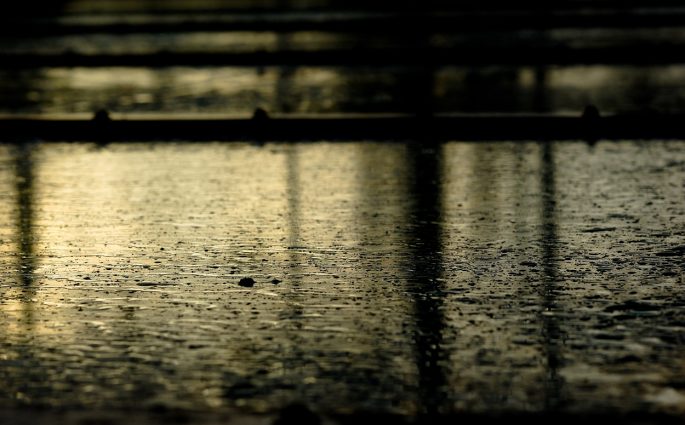 rain falling on pavement