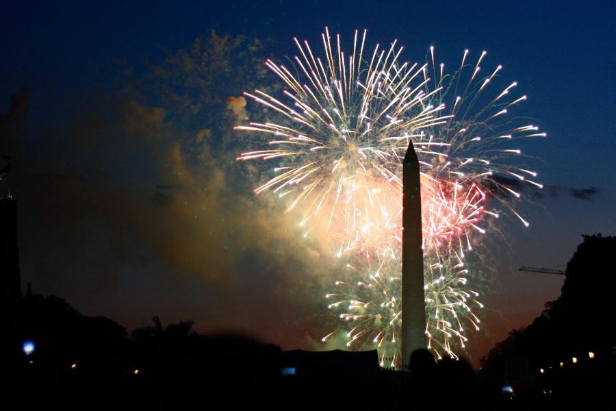 Fireworks going off behind Washington Monument