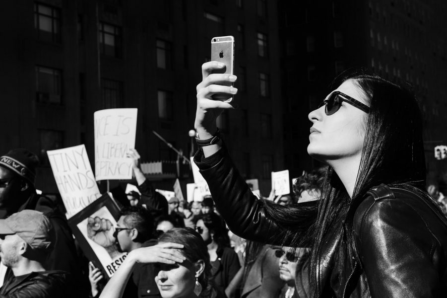 Protester holding up cellphone